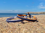Action taker 1 KG - Solnedgångsorange & Havsblå, armband från CleanSea